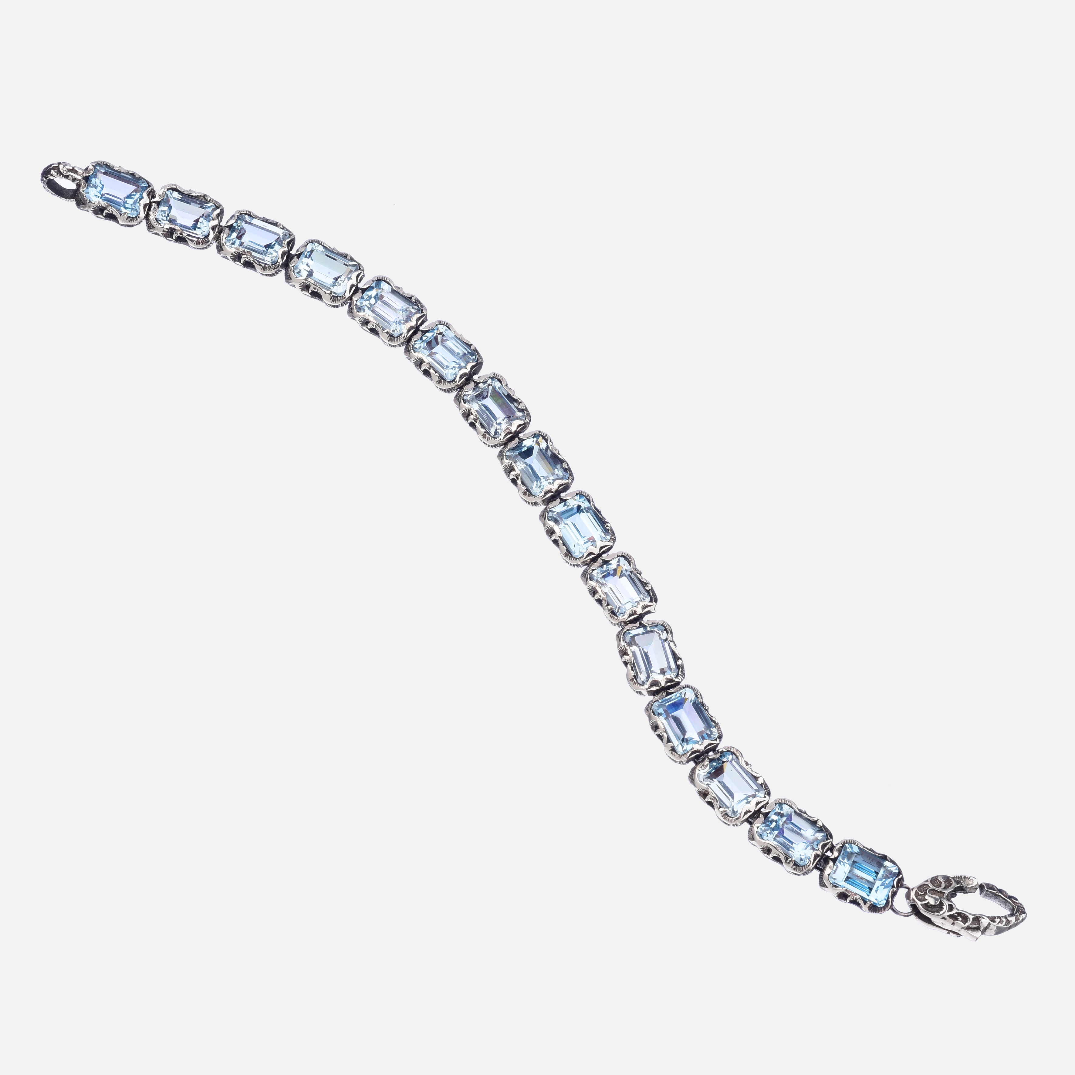 BRACCIALE TENNIS IN ARGENTO INTAGLIATO CON 15 PIETRE TAGLIO SMERALDO (8x6)   CRISTALLO DI ROCCA